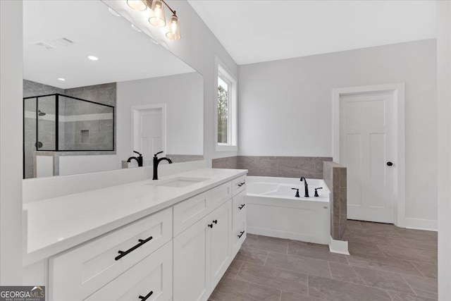 bathroom with vanity and plus walk in shower