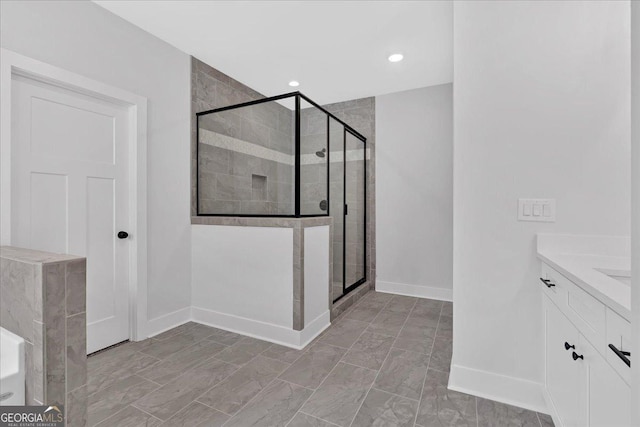 bathroom featuring vanity and a shower with shower door