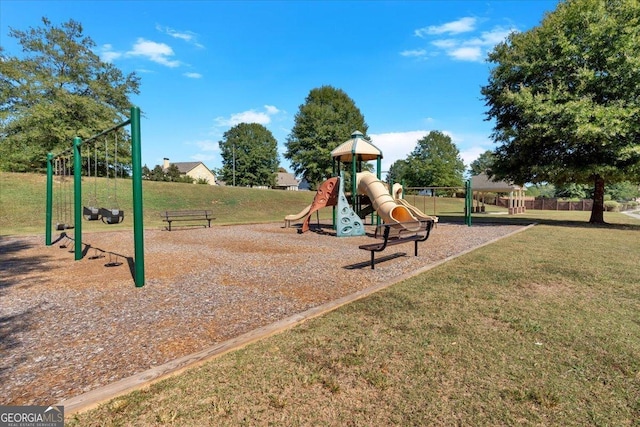 view of playground with a lawn