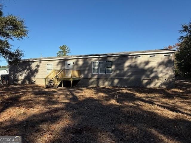 rear view of house with a deck