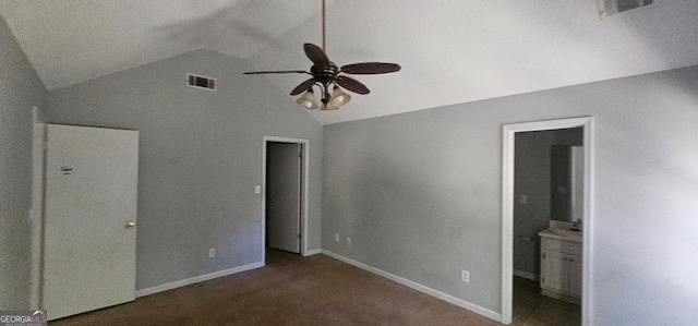 unfurnished bedroom with ensuite bath, ceiling fan, carpet, and lofted ceiling