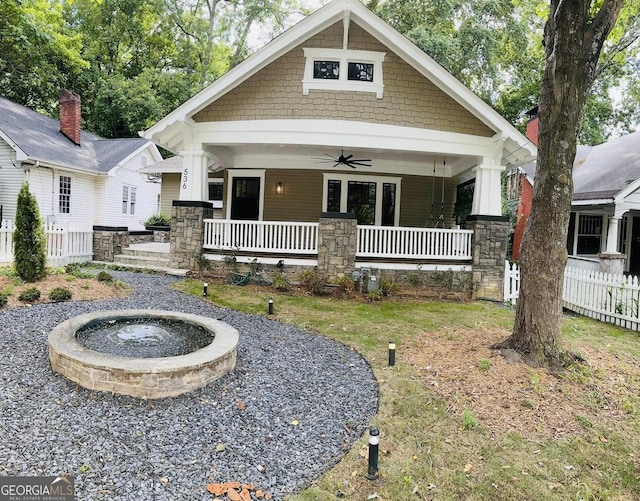 craftsman-style house with ceiling fan, a front lawn, and a porch