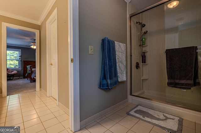 bathroom featuring walk in shower, ceiling fan, tile patterned flooring, and ornamental molding