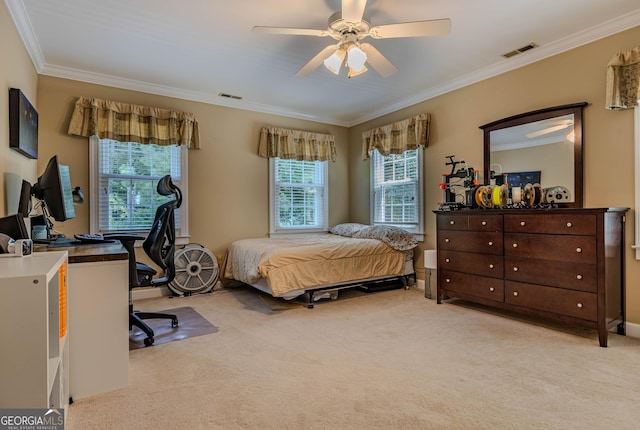 bedroom with ceiling fan, crown molding, and light carpet