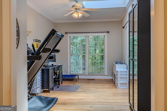 interior space with light hardwood / wood-style floors, ceiling fan, and ornamental molding