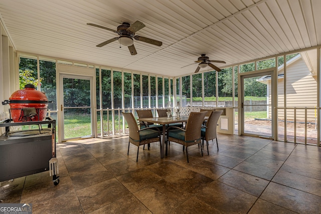 sunroom / solarium with ceiling fan and wood ceiling