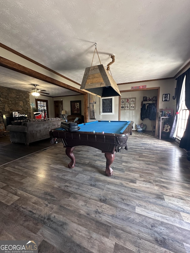 playroom with ceiling fan, billiards, crown molding, wood-type flooring, and a textured ceiling