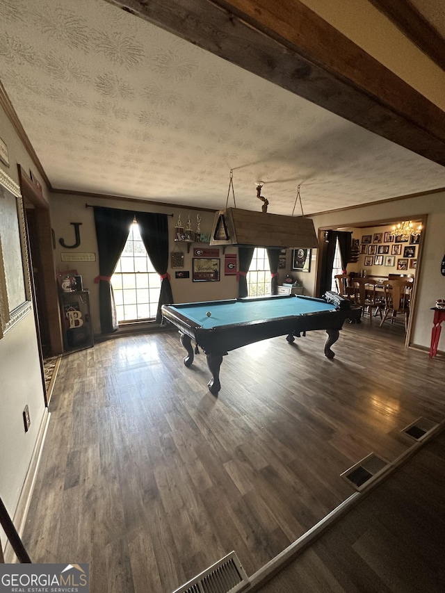 rec room with dark hardwood / wood-style flooring, ornamental molding, a textured ceiling, and billiards