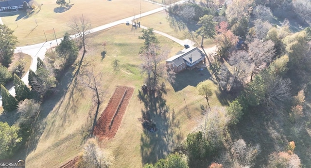 birds eye view of property featuring a rural view