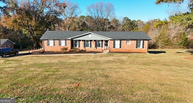 ranch-style home with a front yard