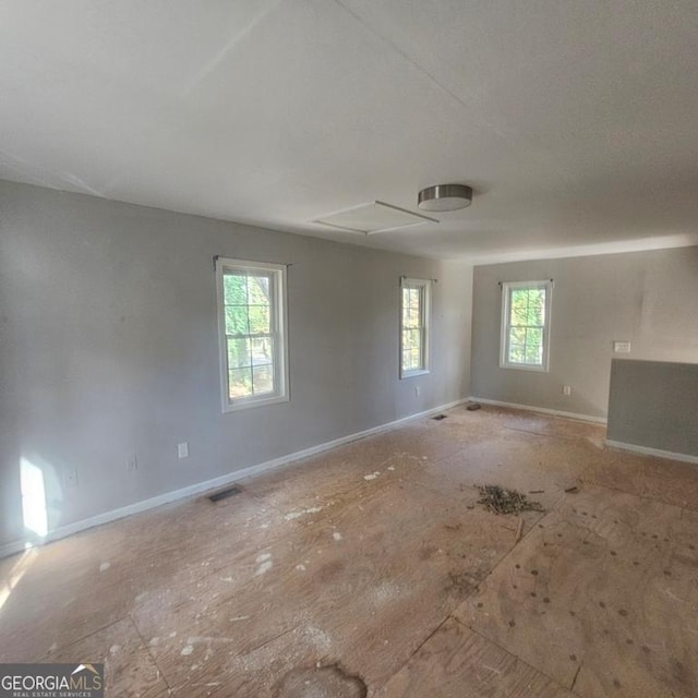 spare room featuring a wealth of natural light