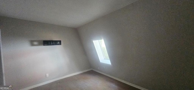 empty room with lofted ceiling