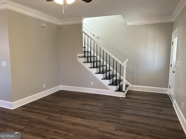 entryway with dark hardwood / wood-style floors, ceiling fan, and ornamental molding