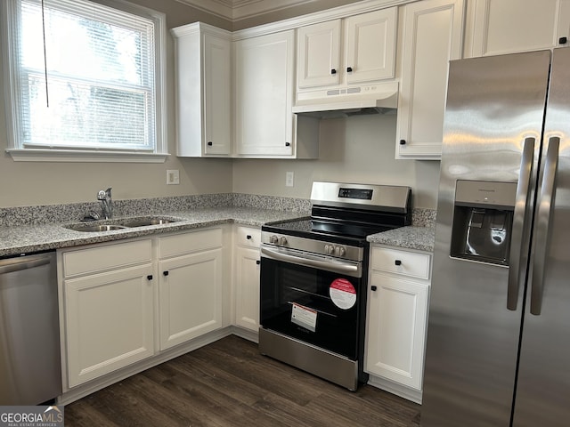 kitchen featuring light stone counters, sink, white cabinets, and appliances with stainless steel finishes