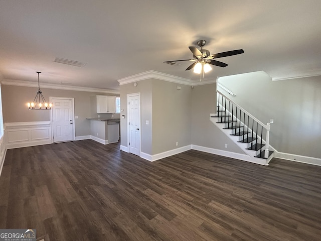 unfurnished living room featuring dark hardwood / wood-style flooring, ceiling fan with notable chandelier, and ornamental molding