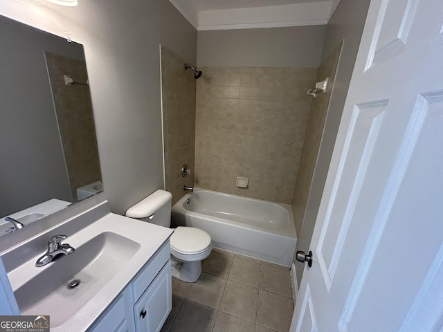 full bathroom with vanity, crown molding, tile patterned flooring, tiled shower / bath combo, and toilet