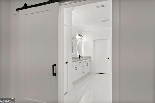 bathroom with vanity and crown molding