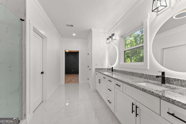 bathroom featuring vanity and ornamental molding