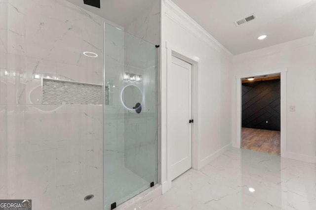 bathroom with crown molding and walk in shower