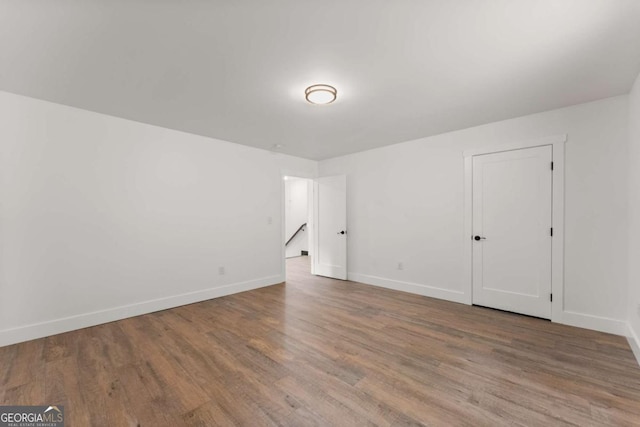 empty room featuring wood-type flooring