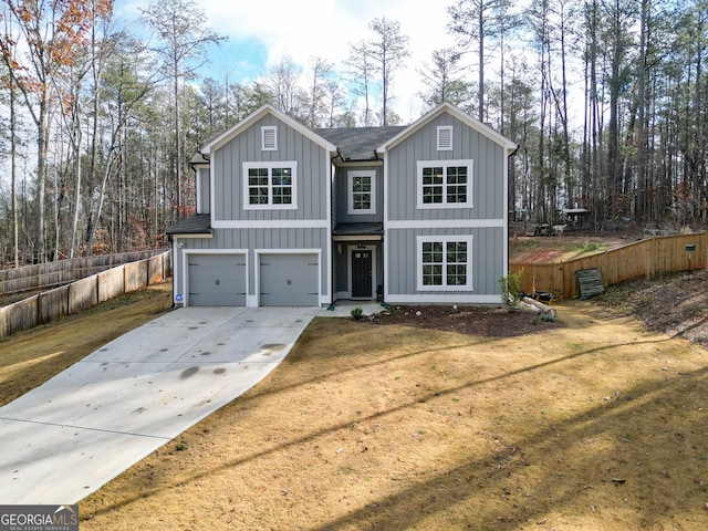 view of front facade featuring a garage and a front lawn