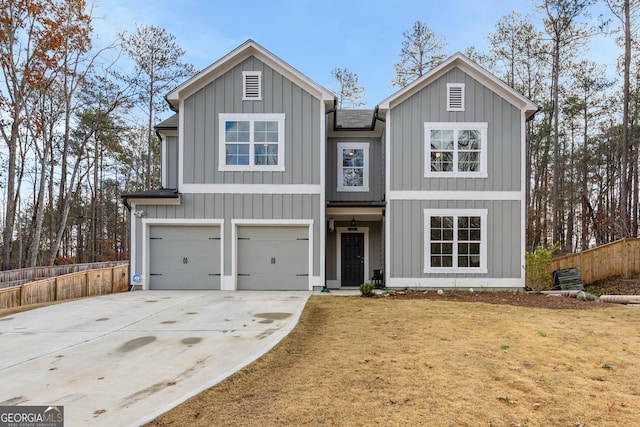 view of front facade with a front yard and a garage