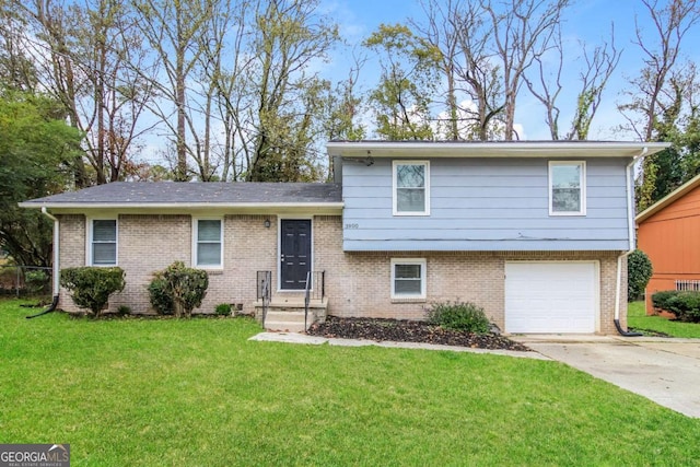 split level home featuring a front yard and a garage