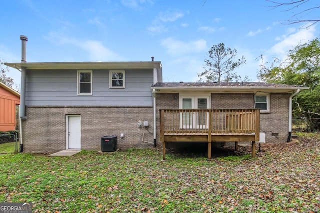 rear view of property featuring central AC and a deck