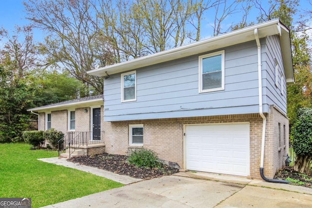 split level home featuring a front lawn and a garage