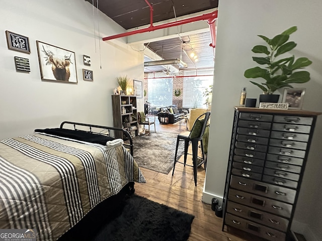 bedroom featuring hardwood / wood-style flooring