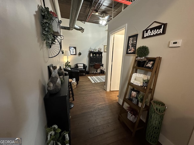 hallway featuring dark wood-type flooring