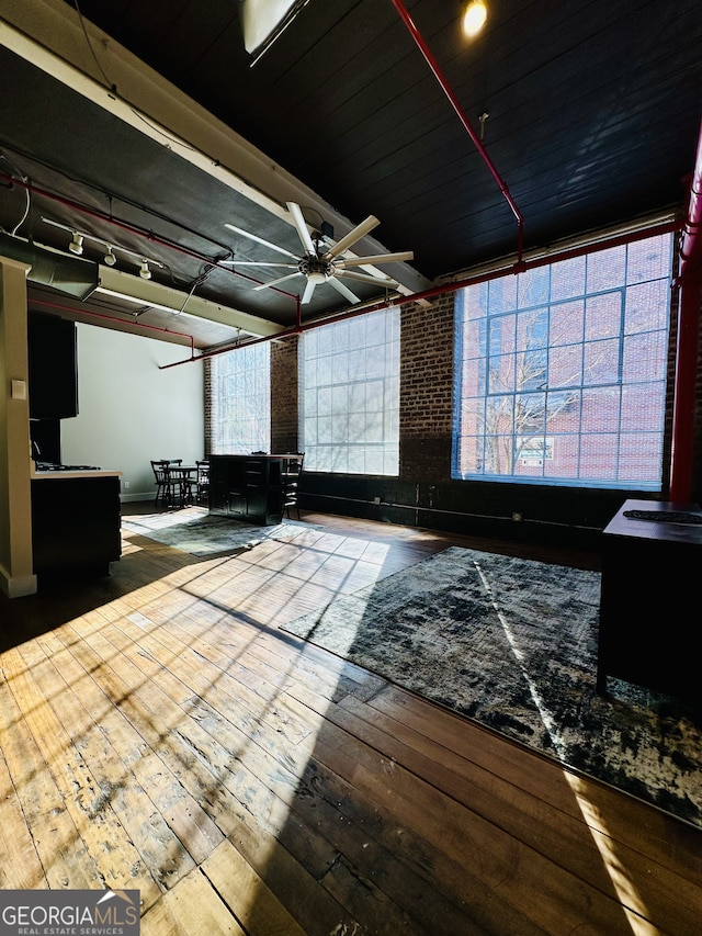 interior space featuring ceiling fan and wood-type flooring