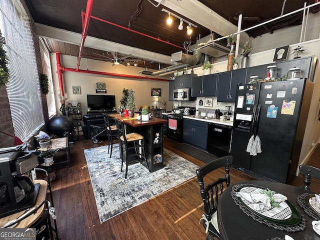 kitchen featuring ceiling fan, tasteful backsplash, black electric range oven, refrigerator with ice dispenser, and dark hardwood / wood-style floors