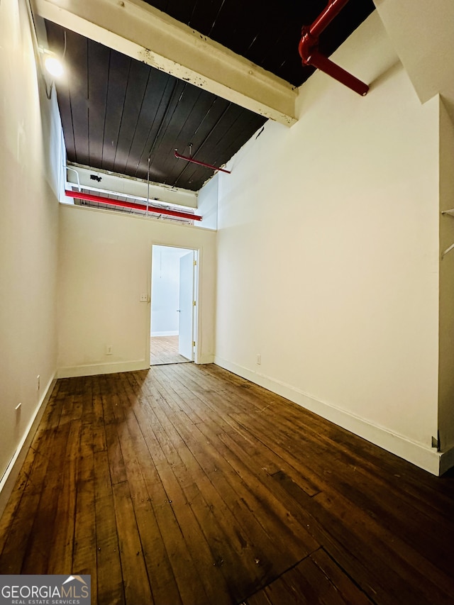 unfurnished room with hardwood / wood-style floors