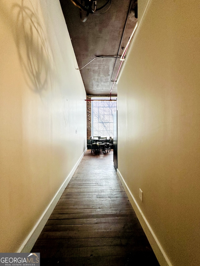 corridor featuring hardwood / wood-style floors