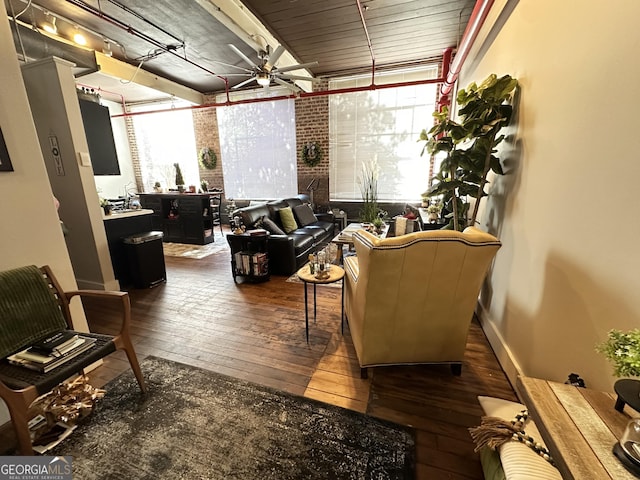 interior space featuring wood-type flooring, a wealth of natural light, and ceiling fan