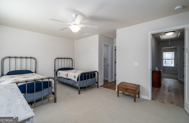 bedroom with ceiling fan and wood-type flooring