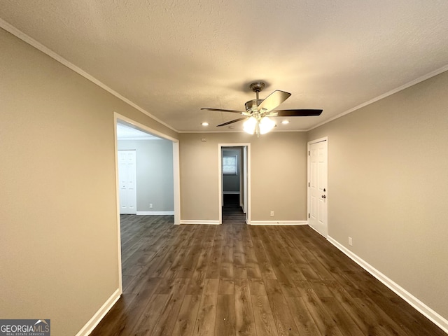 unfurnished room with crown molding, dark hardwood / wood-style flooring, ceiling fan, and a textured ceiling