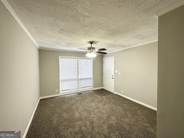 carpeted spare room featuring a textured ceiling, ceiling fan, and ornamental molding