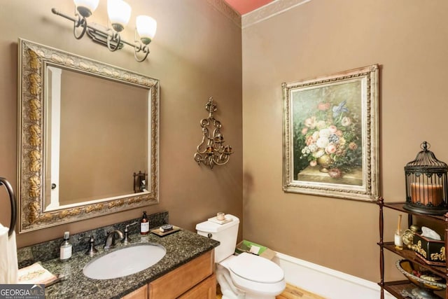 bathroom featuring vanity and toilet