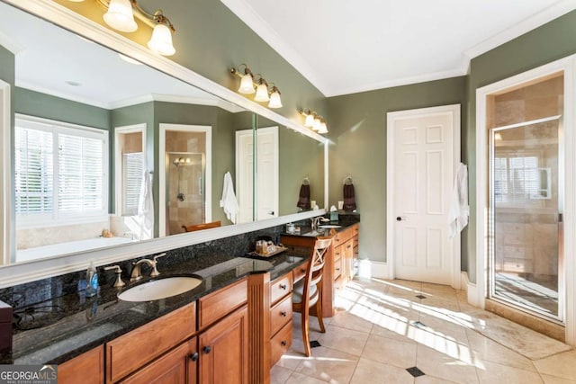 bathroom featuring vanity, tile patterned floors, a shower with shower door, and crown molding