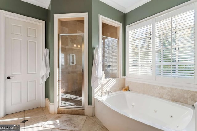 bathroom with tile patterned floors, ornamental molding, and shower with separate bathtub