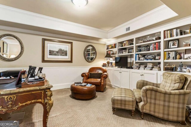 living area featuring light carpet and crown molding