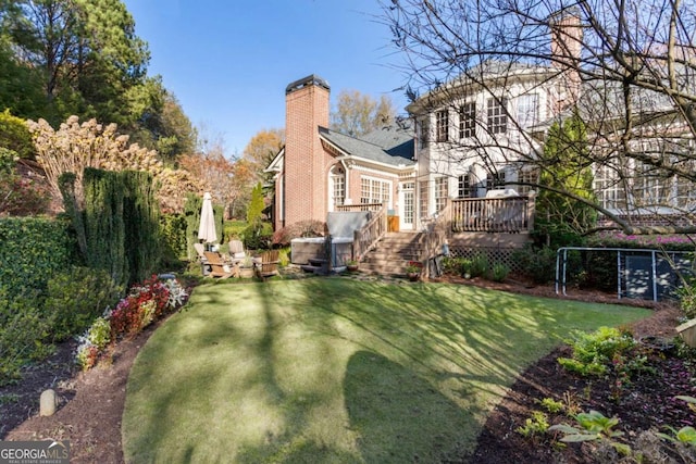 view of yard with a wooden deck