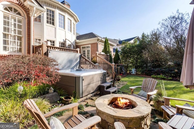 view of yard with a fire pit and a deck