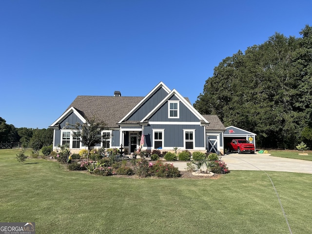 view of front facade with a garage and a front lawn