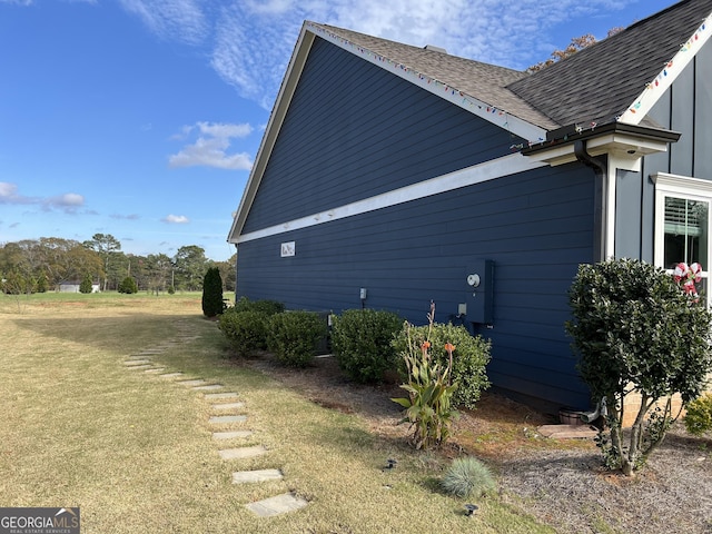 view of property exterior featuring a lawn