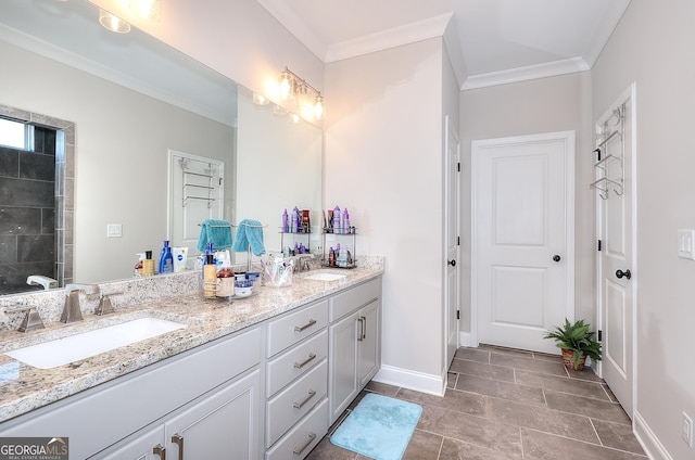 bathroom with tile patterned flooring, crown molding, and vanity