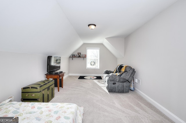 living area featuring vaulted ceiling and carpet floors