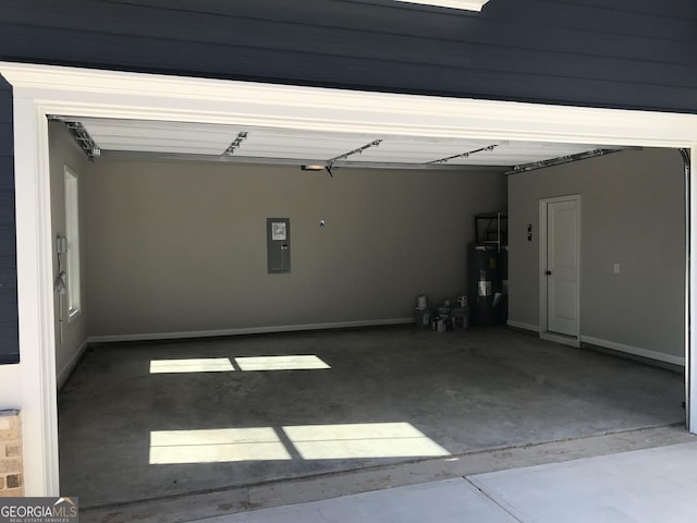 garage featuring electric panel and water heater